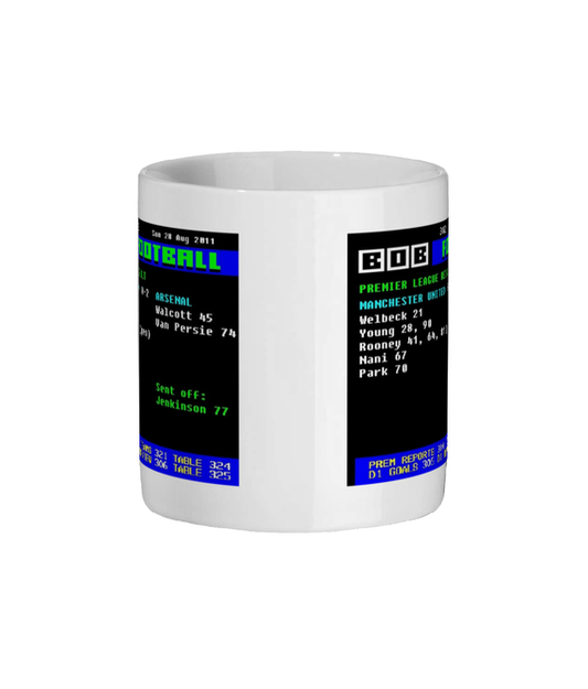 White mug with a graphic of a sports scoreboard on a black background